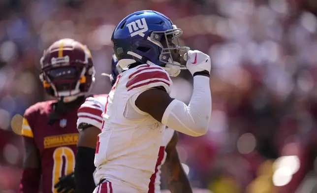 New York Giants wide receiver Malik Nabers, front celebrates his touchdown catch against the Washington Commanders during the first half of an NFL football game in Landover, Md., Sunday, Sept. 15, 2024. (AP Photo/Matt Slocum)