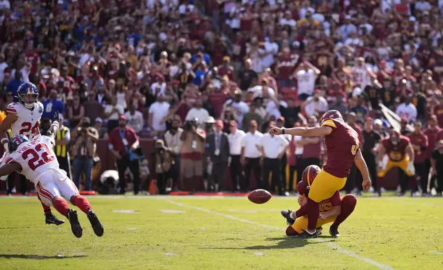 Washington Commanders place kicker Austin Seibert (3) kicks the game-winning field goal against the New York Giants as time expires during the second half of an NFL football game in Landover, Md., Sunday, Sept. 15, 2024. (AP Photo/Matt Slocum)