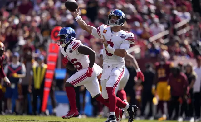 New York Giants quarterback Daniel Jones (8) throws a pass against the Washington Commanders during the second half of an NFL football game in Landover, Md., Sunday, Sept. 15, 2024. (AP Photo/Matt Slocum)