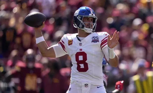 New York Giants quarterback Daniel Jones (8) looks to pass against the Washington Commanders during the first half of an NFL football game in Landover, Md., Sunday, Sept. 15, 2024. (AP Photo/Matt Slocum)