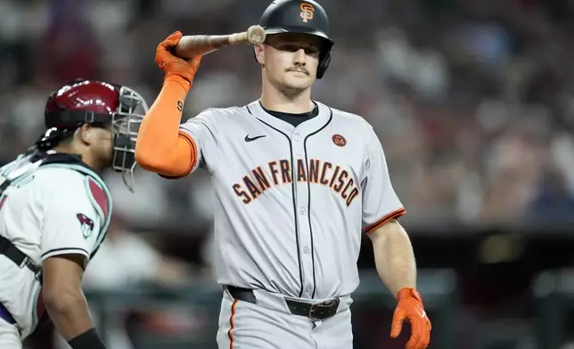 San Francisco Giants' Matt Chapman tosses his bat after striking out against the Arizona Diamondbacks during the sixth inning of a baseball game Wednesday, Sept. 25, 2024, in Phoenix. (AP Photo/Ross D. Franklin)