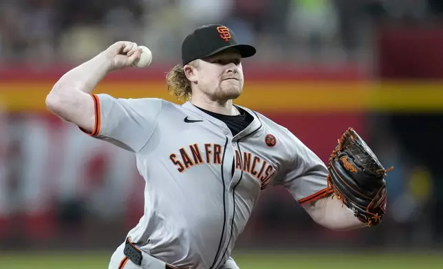 San Francisco Giants starting pitcher Logan Webb throws against the Arizona Diamondbacks during the first inning of a baseball game Tuesday, Sept. 24, 2024, in Phoenix. (AP Photo/Ross D. Franklin)