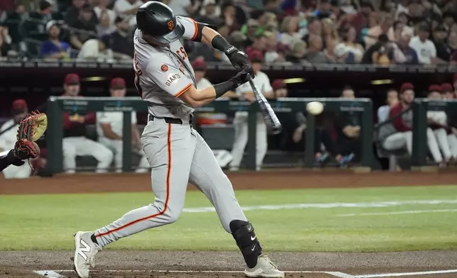 San Francisco Giants' Tyler Fitzgerald connects for a run-scoring double against the Arizona Diamondbacks during the second inning of a baseball game Wednesday, Sept. 25, 2024, in Phoenix. (AP Photo/Ross D. Franklin)