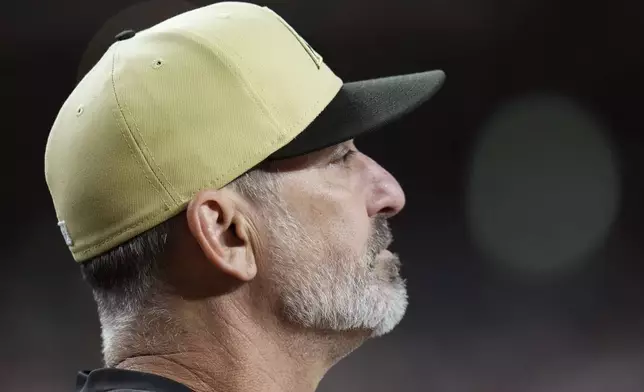 Arizona Diamondbacks manager Torey Lovullo watches the action on the field during the first inning of a baseball game against the San Francisco Giants, Tuesday, Sept. 24, 2024, in Phoenix. (AP Photo/Ross D. Franklin)