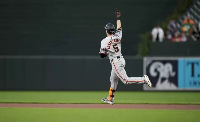 San Francisco Giants' Mike Yastrzemski rounds the bases after hitting a home run during the first inning of a baseball game against the Baltimore Orioles, Wednesday, Sept. 18, 2024, in Baltimore. (AP Photo/Stephanie Scarbrough)