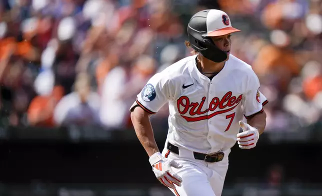 Baltimore Orioles' Jackson Holliday (7) advances toward first base after hitting a single to score two runs during the fourth inning of a baseball game against the San Francisco Giants, Thursday, Sept. 19, 2024, in Baltimore. (AP Photo/Stephanie Scarbrough)