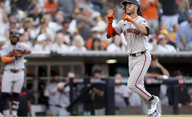 San Francisco Giants' Grant McCray celebrates after hitting a three-run home run during the second inning of a baseball game against the San Diego Padres, Saturday, Sept. 7, 2024, in San Diego. (AP Photo/Ryan Sun)