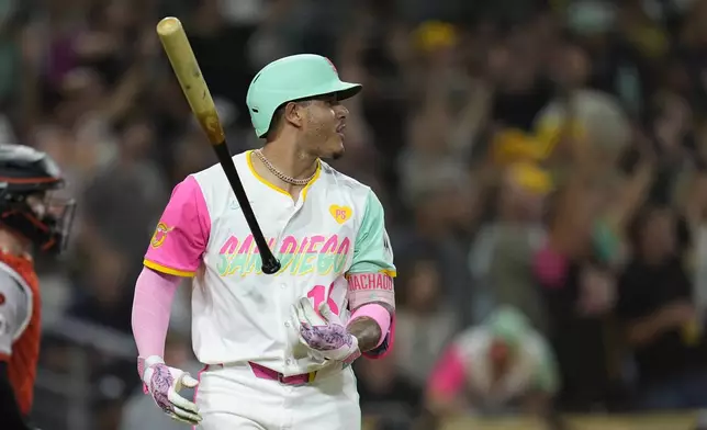 San Diego Padres' Manny Machado watches his home run during the eighth inning of a baseball game against the San Francisco Giants, Friday, Sept. 6, 2024, in San Diego. (AP Photo/Gregory Bull)