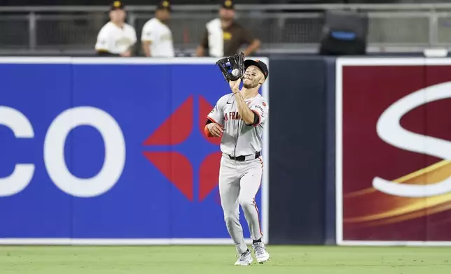 San Francisco Giants center fielder Grant McCray catches a flyout by San Diego Padres' Luis Campusano during the sixth inning of a baseball game Saturday, Sept. 7, 2024, in San Diego. (AP Photo/Ryan Sun)