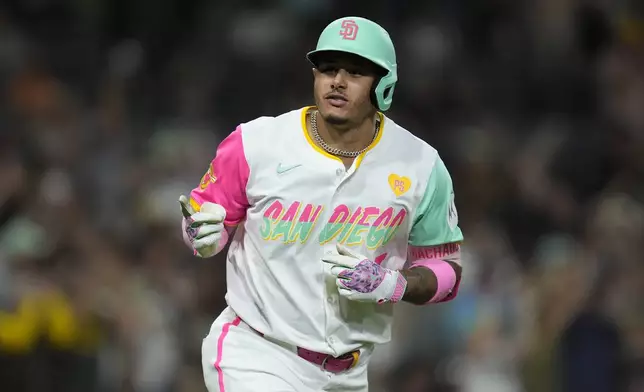 San Diego Padres' Manny Machado celebrates after hitting a home run during the eighth inning of a baseball game against the San Francisco Giants, Friday, Sept. 6, 2024, in San Diego. (AP Photo/Gregory Bull)