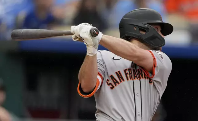 San Francisco Giants' Brett Wisely watches his RBI single during the second inning of a baseball game against the Kansas City Royals Sunday, Sept. 22, 2024, in Kansas City, Mo. (AP Photo/Charlie Riedel)