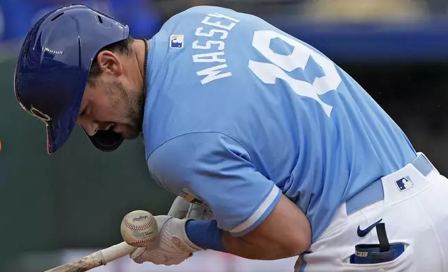 Kansas City Royals' Michael Massey is hit by a pitch thrown by San Francisco Giants relief pitcher Tyler Rogers during the eighth inning of a baseball game Sunday, Sept. 22, 2024, in Kansas City, Mo. (AP Photo/Charlie Riedel)