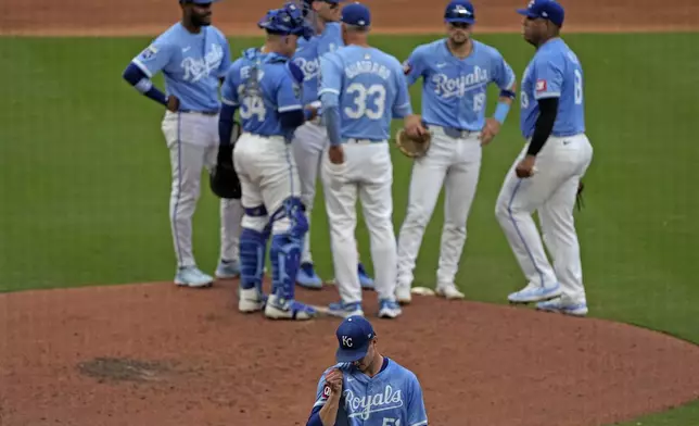 Kansas City Royals starting pitcher Brady Singer (51) walks to the dugout after coming out of the game during the sixth inning of a baseball game against the San Francisco Giants Saturday, Sept. 21, 2024, in Kansas City, Mo. (AP Photo/Charlie Riedel)