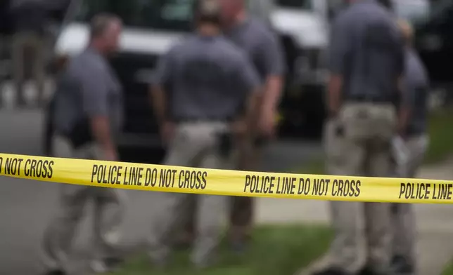 FILE - Authorities continue to work at the home of suspect Rex Heuermann, who has been charged with the slayings known as the Gilgo Beach killings, in Massapequa Park, N.Y., July 24, 2023. (AP Photo/Seth Wenig, File)