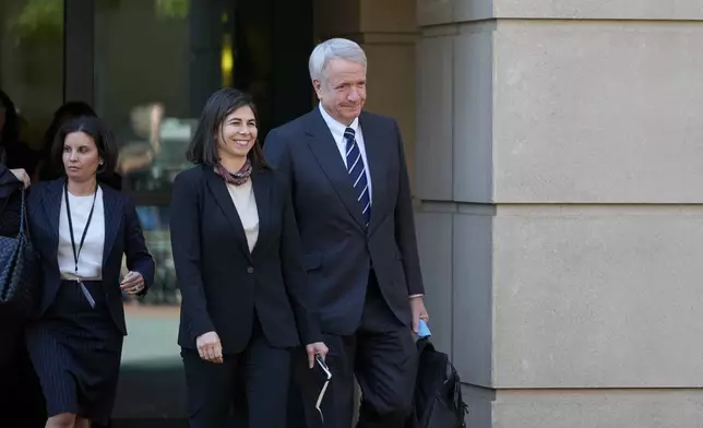 Eric Mahr, right, a lawyer representing Google in the Department of Justice's antitrust case against the tech giant, leaves the U.S. District Court for the Eastern District of Virginia for a lunch break in the trial, Monday, Sept. 9, 2024, in Alexandria, Va. (AP Photo/Stephanie Scarbrough)