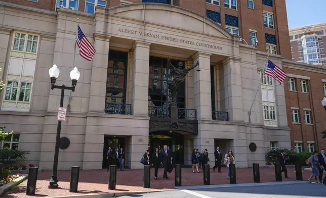 Lawyers leave the U.S. District Court for the Eastern District of Virginia for a lunch break in the Department of Justice's antitrust trial against tech giant Google, Monday, Sept. 9, 2024, in Alexandria, Va. One month after a judge declared Google's search engine an illegal monopoly, the tech giant faces another antitrust lawsuit that threatens to break up the company, this time over its advertising technology. (AP Photo/Stephanie Scarbrough)