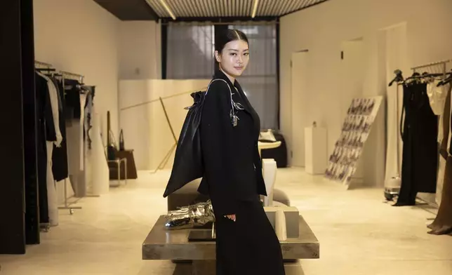 Singapore designer Grace Ling poses in her showroom where she displays her 3D printed designs on Friday, Sept. 13, 2024, in New York. Ling, a CFDA/Vogue Fashion Fund finalist, showcased her latest collection at New York Fashion Week. (Photo by Matt Licari/Invision/AP)