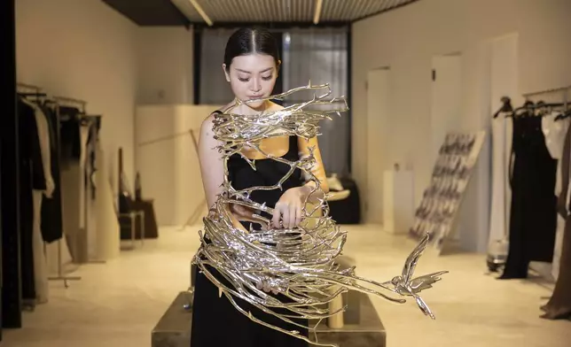 Singapore designer Grace Ling displays 3D printed designs from her New York Fashion Week collection on Friday, Sept. 13, 2024, in New York. Ling is one of ten designers competing in the 2024 CFDA/Vogue Fashion Fund. (Photo by Matt Licari/Invision/AP)