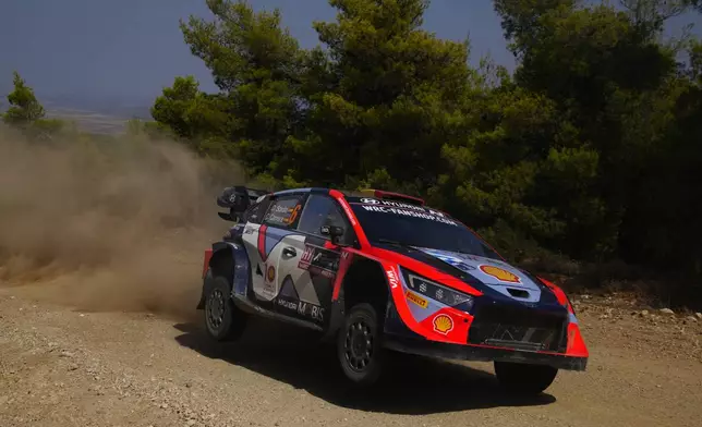 Spain's driver Daniel Sordo and his co-driver Candido Carrera with Hyundai i20 N Rally1 Hybrid compete during a special stage of WRC Acropolis Rally in Thiva, some 90 kilometers (56 miles) north of Athens, Greece, Saturday, Sept. 7, 2024. (AP Photo/Thanassis Stavrakis)