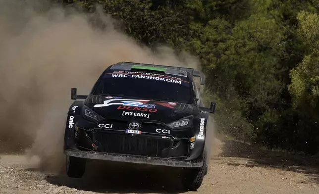 Britain's driver Elfyn Evans and his co-driver Scott Martins with Toyota GR Yaris Rally1 Hybrid, compete during a special stage of WRC Acropolis Rally in Thiva, some 90 kilometers (56 miles) north of Athens, Greece, Saturday, Sept. 7, 2024. (AP Photo/Thanassis Stavrakis)