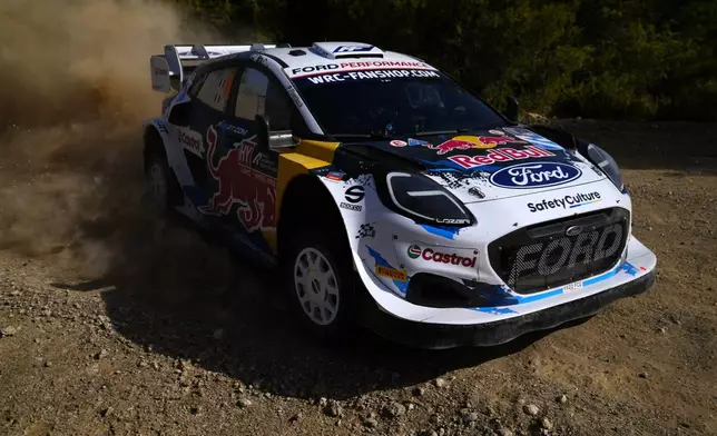 France's driver Adrien Fourmaux and his co-driver Alexandre Coria with Ford Puma Rally1 Hybrid, compete during a special stage of WRC Acropolis Rally in Thiva, some 90 kilometers (56 miles) north of Athens, Greece, Saturday, Sept. 7, 2024. (AP Photo/Thanassis Stavrakis)