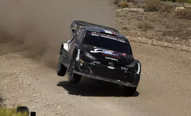 France’s driver Sebastien Ogier and his co-driver Vincent Landais in a Toyota GR Yaris Rally1 Hybrid, compete during a special stage of WRC Acropolis Rally in Thiva, some 90 kilometers (56 miles) north of Athens, Greece, Saturday, Sept. 7, 2024. (AP Photo/Thanassis Stavrakis)