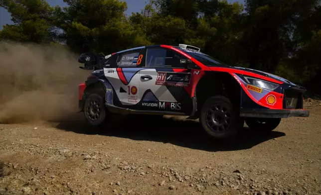 Estonia's driver Ott Tanak and his co-driver Martin Jarveoja with Hyundai i20 N Rally1 Hybrid compete during a special stage of WRC Acropolis Rally in Thiva, some 90 kilometers (56 miles) north of Athens, Greece, Saturday, Sept. 7, 2024. (AP Photo/Thanassis Stavrakis)