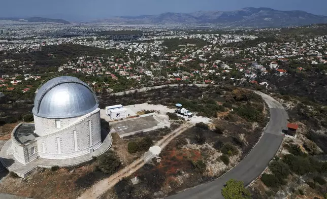 The area around National Observatory on Penteli mountain, which had been burned in a mid-August wildfire, is seen in northern Athens, Thursday, Aug. 22, 2024. (AP Photo/Thanassis Stavrakis)