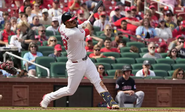 St. Louis Cardinals' Nolan Arenado hits an RBI single during the sixth inning of a baseball game against the Cleveland Guardians Sunday, Sept. 22, 2024, in St. Louis. (AP Photo/Jeff Roberson)