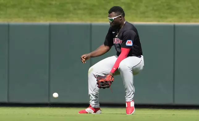 Cleveland Guardians right fielder Jhonkensy Noel reaches for an RBI single by St. Louis Cardinals' Nolan Arenado during the sixth inning of a baseball game Sunday, Sept. 22, 2024, in St. Louis. (AP Photo/Jeff Roberson)