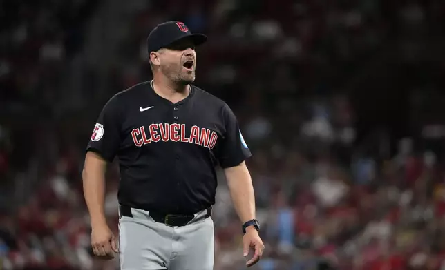 Cleveland Guardians manager Stephen Vogt walks back from the mound after making a pitching change during the sixth inning of a baseball game against the St. Louis Cardinals Saturday, Sept. 21, 2024, in St. Louis. (AP Photo/Jeff Roberson)