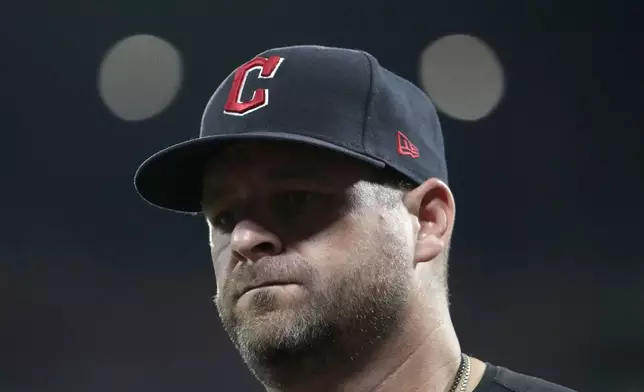 Cleveland Guardians manager Stephen Vogt walks back from the mound after making a pitching change during the sixth inning of a baseball game against the St. Louis Cardinals Saturday, Sept. 21, 2024, in St. Louis. (AP Photo/Jeff Roberson)