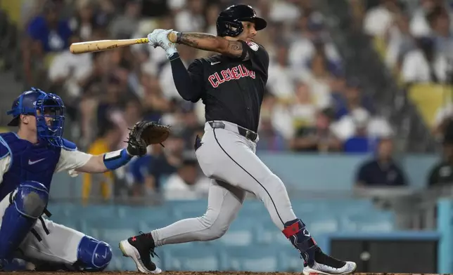 Cleveland Guardians' Brayan Rocchio singles during the sixth inning of a baseball game against the Los Angeles Dodgers in Los Angeles, Friday, Sept. 6, 2024. (AP Photo/Ashley Landis)