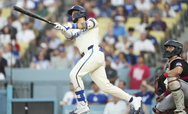 Los Angeles Dodgers left fielder Andy Pages (44) swings during a baseball game against the Cleveland Guardians in Los Angeles, Saturday, Sept. 7, 2024. (AP Photo/Ashley Landis)