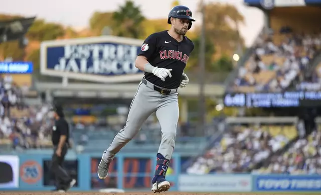 Cleveland Guardians' Lane Thomas runs the bases after hitting a home run during the second inning of a baseball game against the Los Angeles Dodgers in Los Angeles, Saturday, Sept. 7, 2024. David Fry also scored. (AP Photo/Ashley Landis)