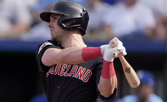 Cleveland Guardians' Lane Thomas watches his two-run home run during the fifth inning of a baseball game against the Kansas City Royals Monday, Sept. 2, 2024, in Kansas City, Mo. (AP Photo/Charlie Riedel)