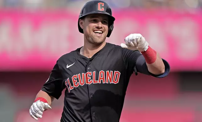 Cleveland Guardians' Lane Thomas celebrates after hitting a two-run home run during the fifth inning of a baseball game against the Kansas City Royals Monday, Sept. 2, 2024, in Kansas City, Mo. (AP Photo/Charlie Riedel)