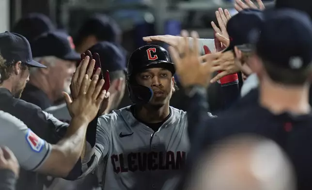 Cleveland Guardians' Bo Naylor celebrates after hitting a home run during the fourth inning of a baseball game against the Chicago White Sox, Monday, Sept. 9, 2024, in Chicago. (AP Photo/Erin Hooley)