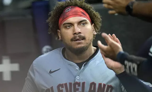 Cleveland Guardians' Josh Naylor celebrates after scoring on a double by Lane Thomas during the first inning of a baseball game against the Chicago White Sox, Monday, Sept. 9, 2024, in Chicago. (AP Photo/Erin Hooley)