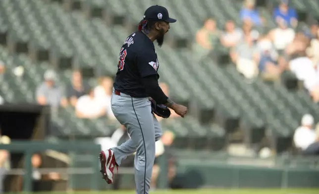 Cleveland Guardians closing pitcher Emmanuel Clase celebrates after defeating the Chicago White Sox 6-4 in a baseball game in Chicago, Wednesday, Sept. 11, 2024. (AP Photo/Paul Beaty)