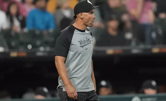 Chicago White Sox interim manager Grady Sizemore walks to the mound to make a pitching change during the fifth inning of a baseball game against the Cleveland Guardians, Monday, Sept. 9, 2024, in Chicago. (AP Photo/Erin Hooley)