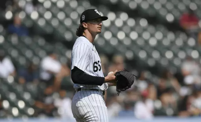 Chicago White Sox starting pitcher Davis Martin reacts after giving up a solo home run to Cleveland Guardians' Austin Hedges during the third inning of a baseball game in Chicago, Wednesday, Sept. 11, 2024. (AP Photo/Paul Beaty)