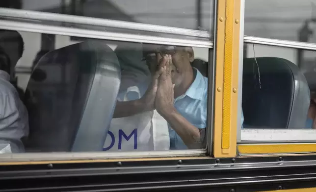 Isaias Ruiz gestures from a bus after being released from a Nicaraguan jail and landing at the airport in Guatemala City, Thursday, Sept. 5, 2024. (AP Photo/Moises Castillo)