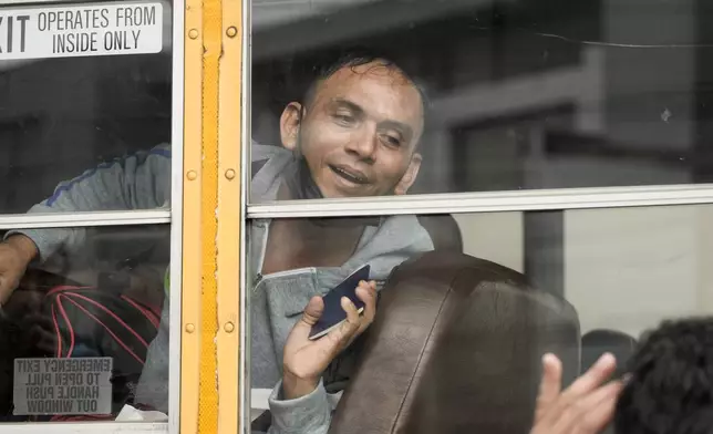 Nicaraguan citizens ride a bus after being released from a Nicaraguan jail and landing at the airport in Guatemala City, Thursday, Sept. 5, 2024. (AP Photo/Moises Castillo)