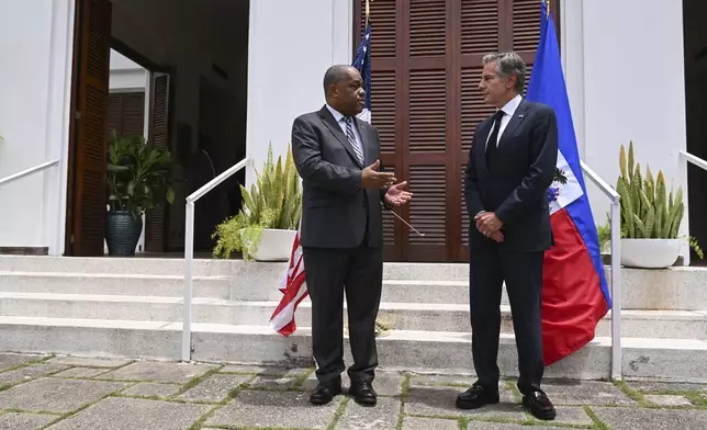 Haitian Prime Minister Garry Conille, left, and U.S. Secretary of State Antony Blinken speak to the press at the U.S. Chief of Mission Residence in Port-au-Prince, Haiti, Thursday, Sept. 5, 2024. (Roberto Schmidt/Pool photo via AP)