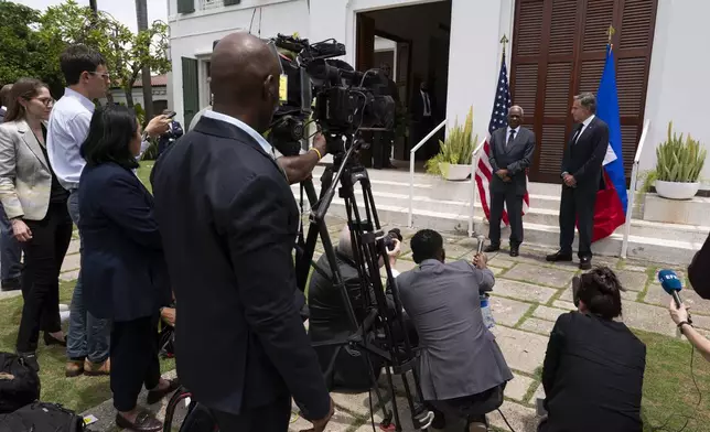 U.S. Secretary of State Antony Blinken, right, and Haitian Transitional Presidential Council Coordinator Edgard Leblanc Fils speak to the press at the U.S. Chief of Mission Residence in Port-au-Prince, Haiti, Thursday, Sept. 5, 2024. (Roberto Schmidt/Pool photo via AP)