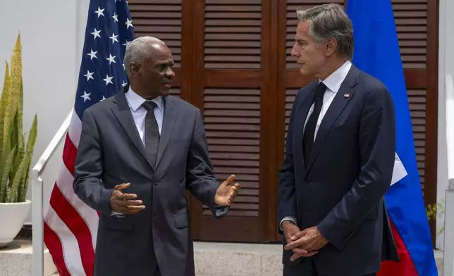 U.S. Secretary of State Antony Blinken, right, and Haitian Transitional Presidential Council Coordinator Edgard Leblanc Fils speak to the press at the U.S. Chief of Mission Residence in Port-au-Prince, Haiti, Thursday, Sept. 5, 2024. (Roberto Schmidt/Pool photo via AP)