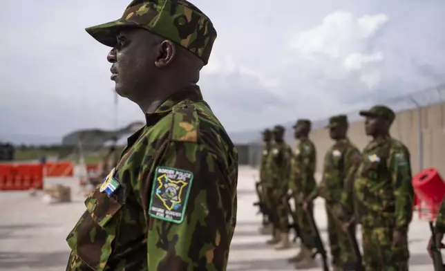 Kenyan members of the Multinational Security Support Mission (MSS) stand at attention as they await the arrival of U.S. Secretary of State Antony Blinken in Port-au-Prince, Haiti, Thursday, Sept. 5, 2024. (Roberto Schmidt/Pool photo via AP)