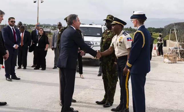 US Secretary of State Antony Blinken, left, greets the Haitian National Police General Director Rameau Normal upon arriving at the MSS base for a meeting in Port Au Prince, Haiti, Thursday, Sept. 5, 2024. (Roberto Schmidt/Pool photo via AP)