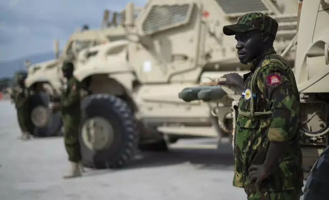 A Kenyan member of the Multinational Security Support (MSS) mission stands next to an armored vehicle moments before U.S. Secretary of State Antony Blinken arrival for a meeting at the base in Port-Au-Prince, Haiti, Thursday, Sept. 5, 2024. (Roberto Schmidt/Pool photo via AP)